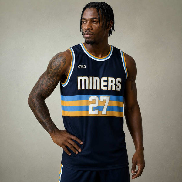 Front view of a navy and yellow Miners Core basketball singlet on a white background, showing the sleeveless U-neck design and side panel detail